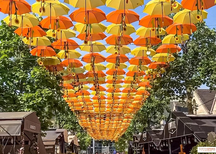 Bercy Village A sky of umbrellas and sunflowers at Bercy Village, Patrícia ... photo